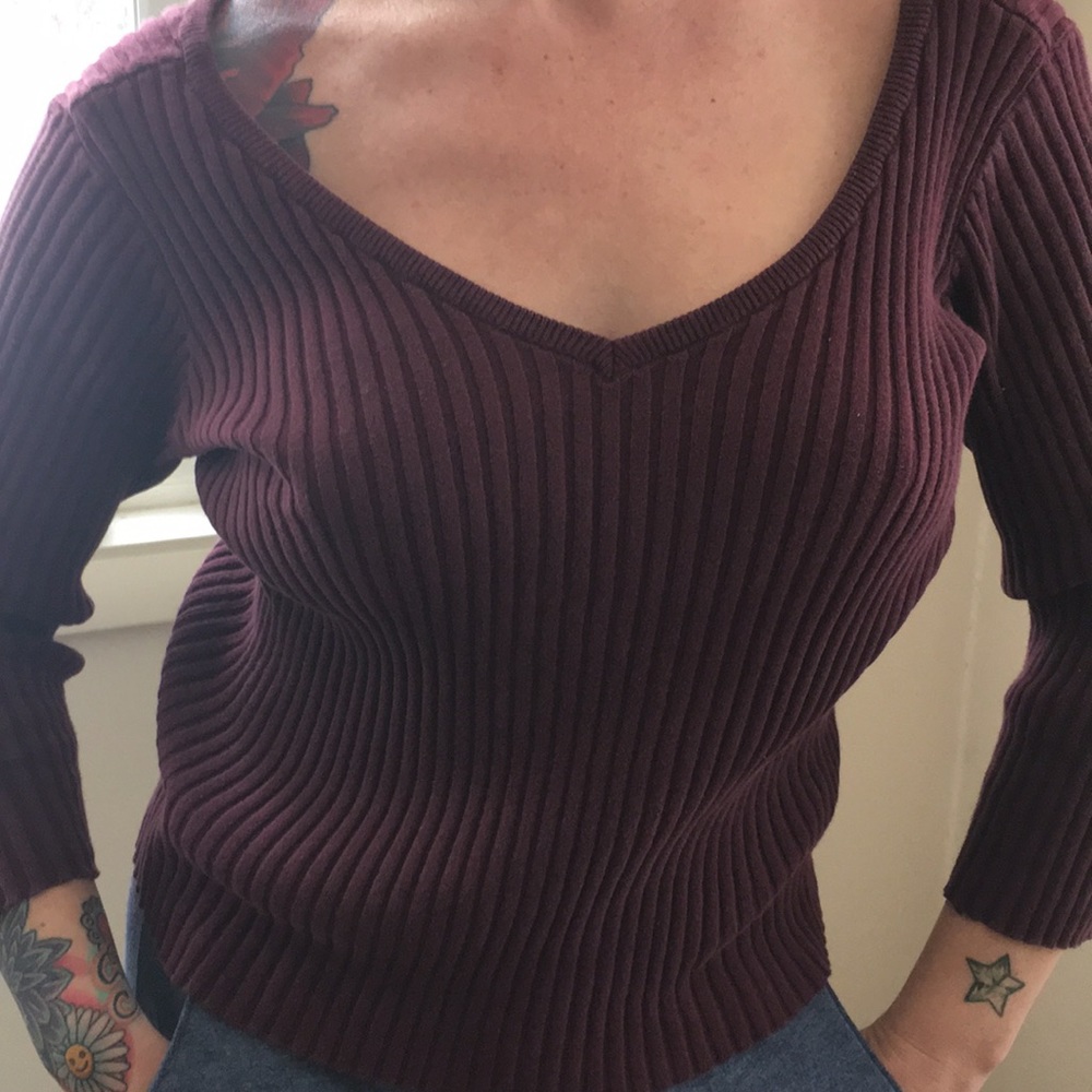 Plum colored forearmed lengthened sweater